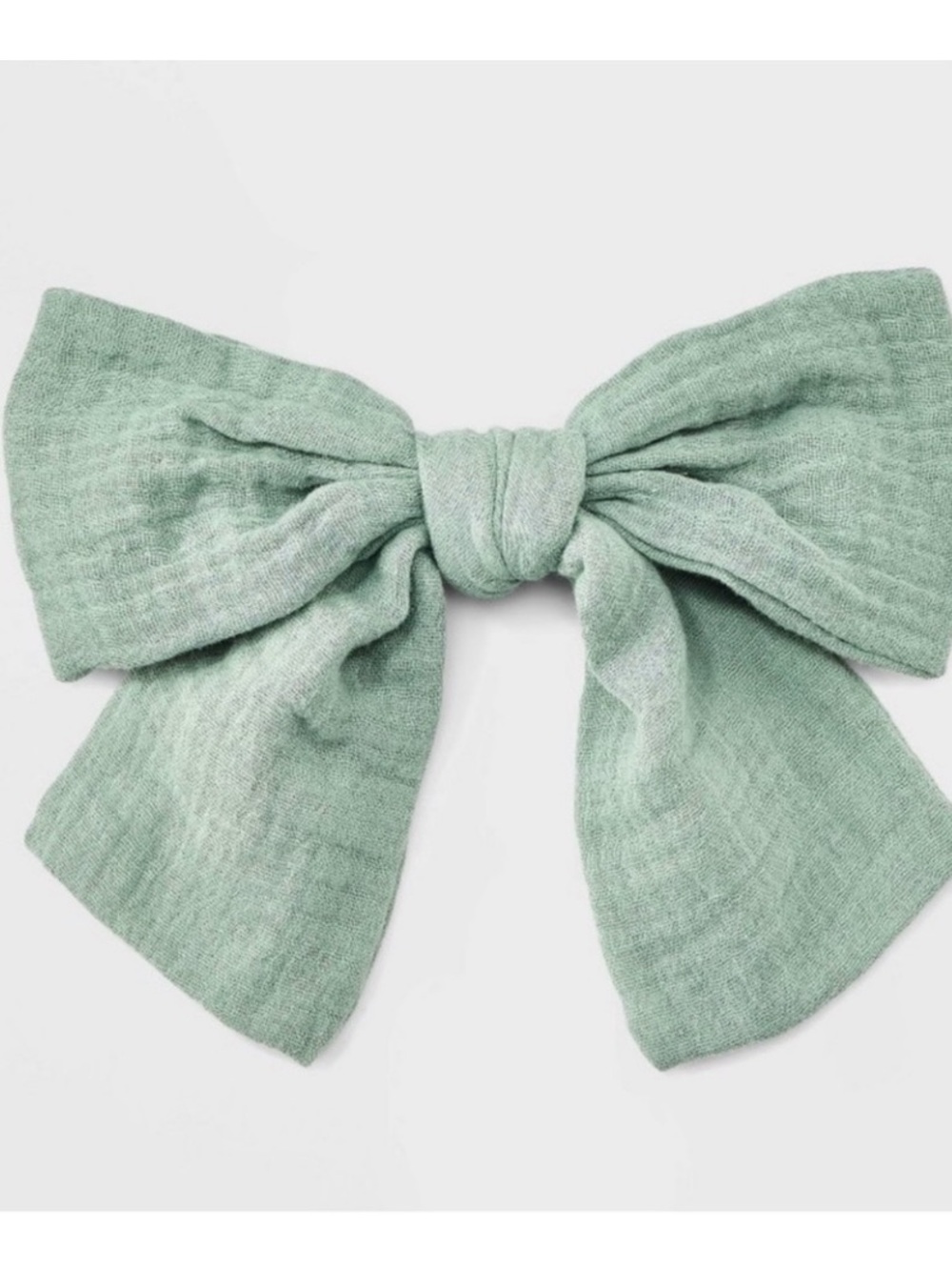 NWT large sage green hair bow of muslin fabric on silver clip, one size